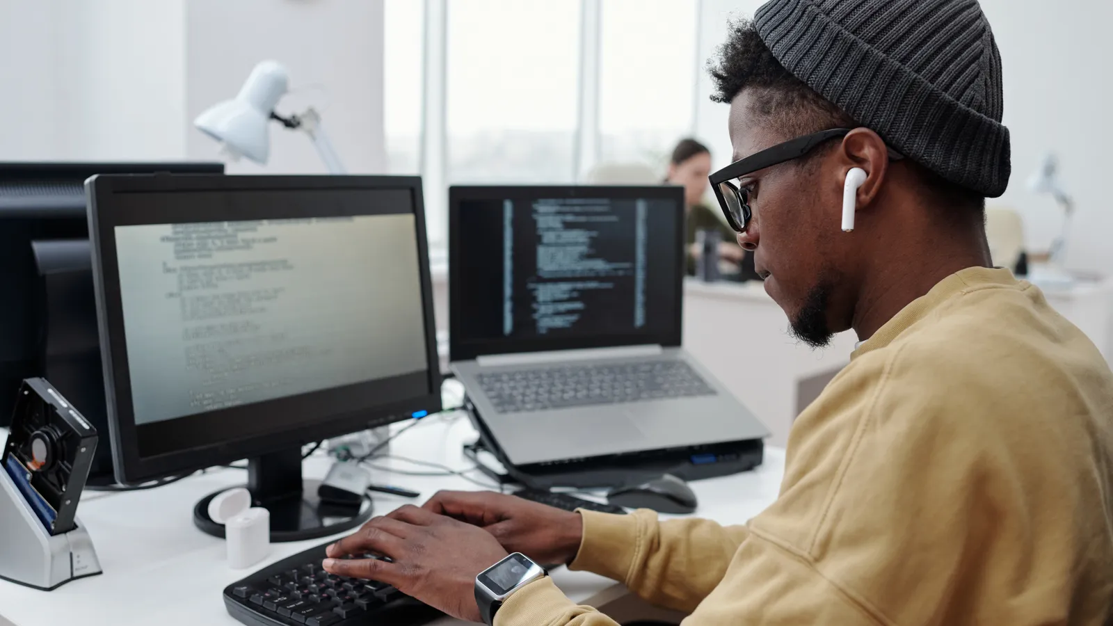 A man works at a computer in a modern New Jersey office